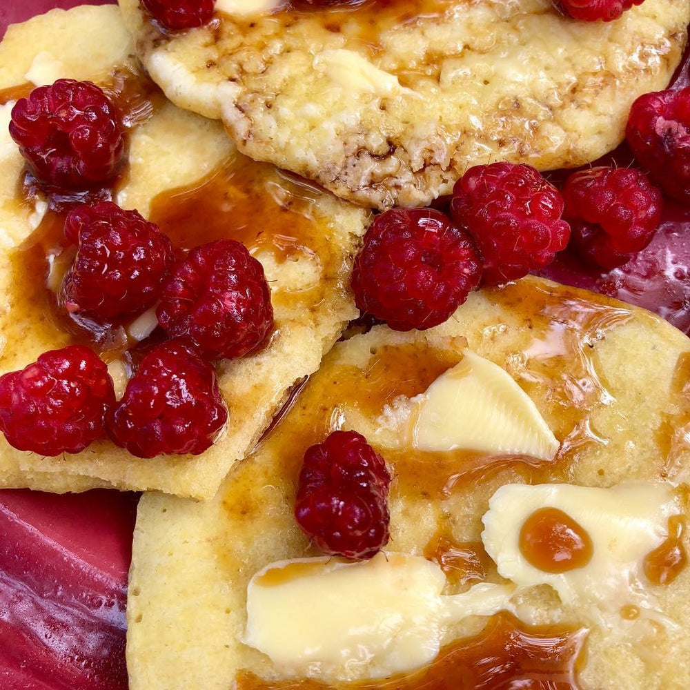 Pancakes with butter and raspberries