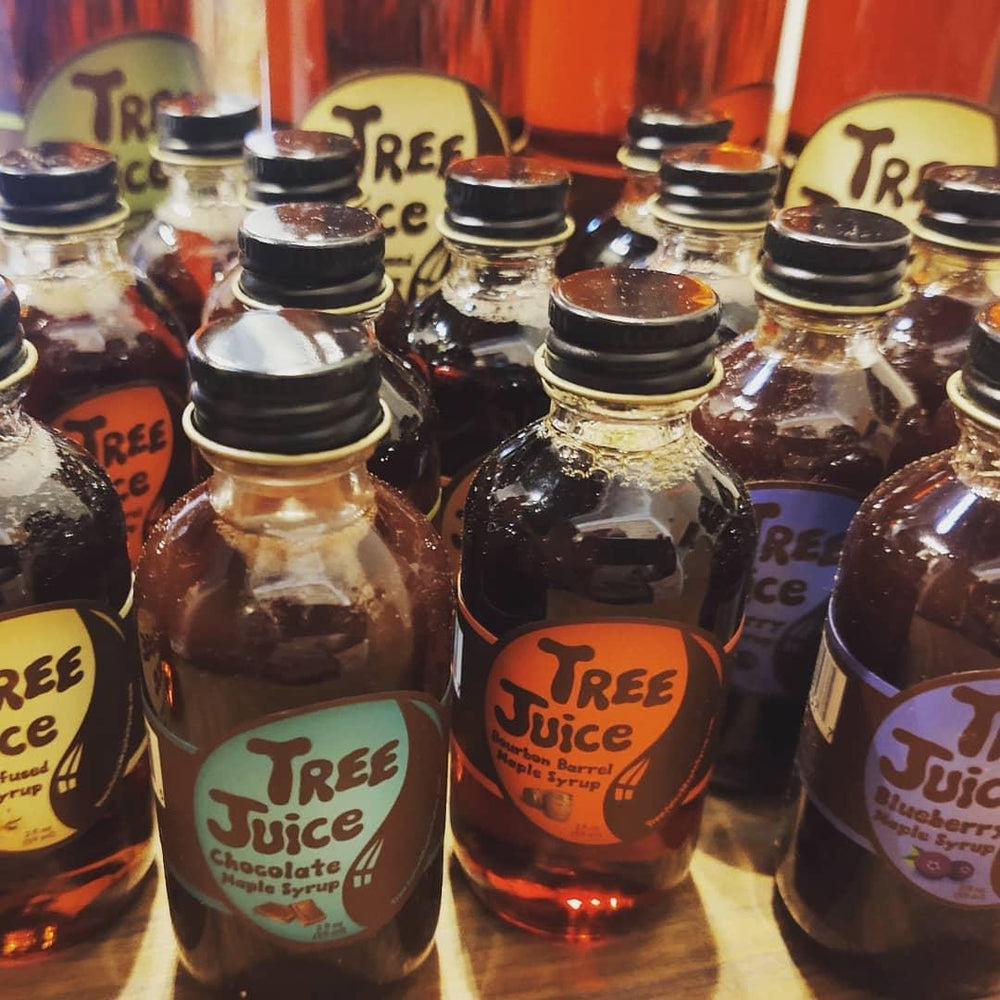 2oz bottles of Tree Juice Maple Syrup on display