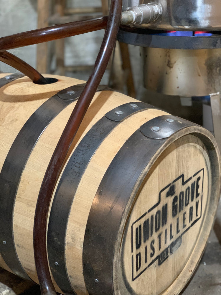 Filling a whiskey barrel with Tree Juice maple syrup